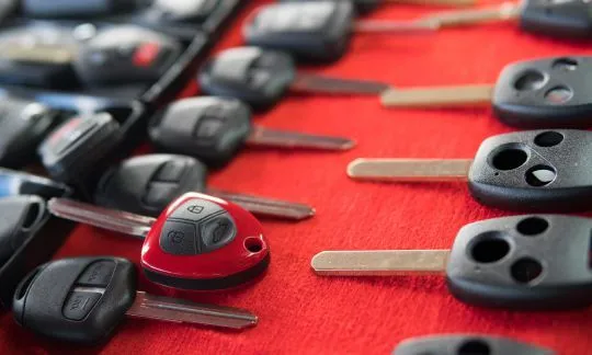 many car keys on table