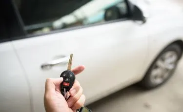 car key in front of cars