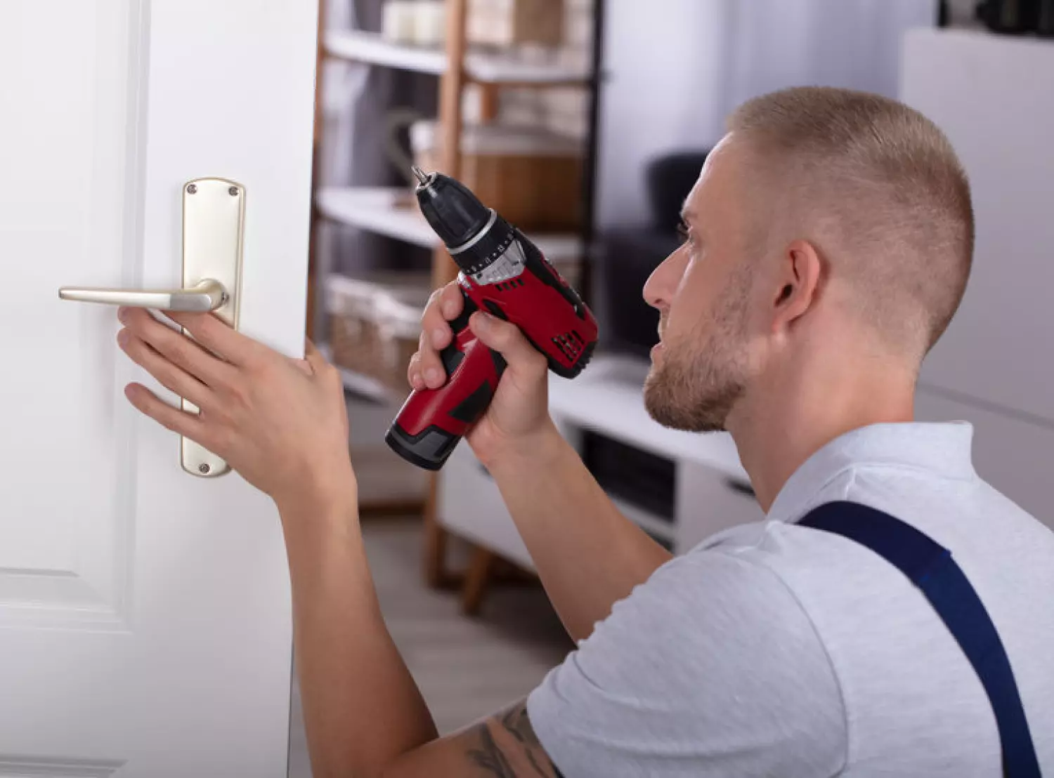 Locksmith installing a door handle