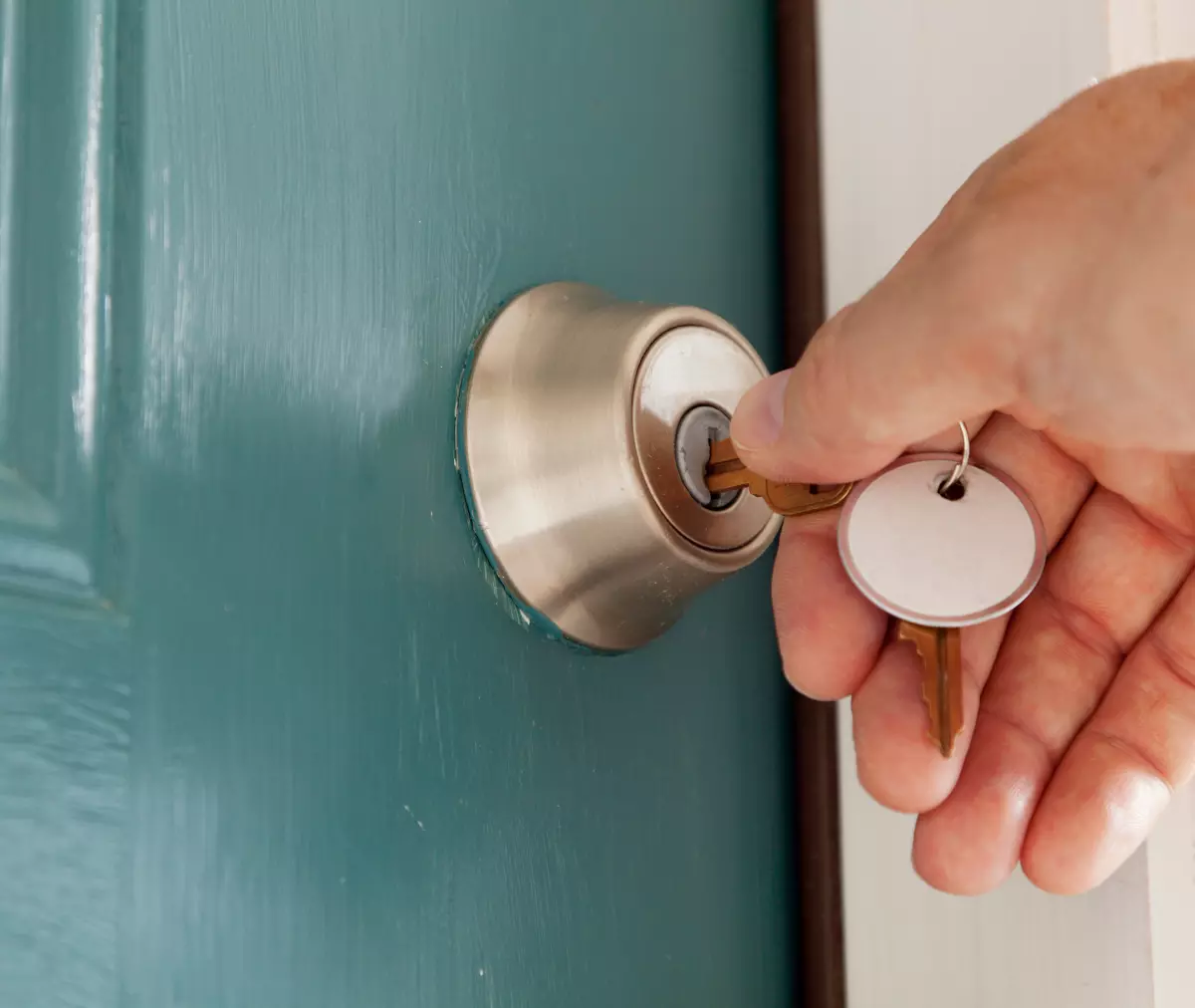 Key being inserted into a residential deadbolt lock