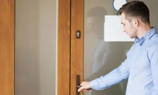 man opens a door
