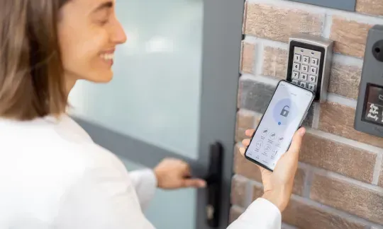 woman open a smart lock via smartphone