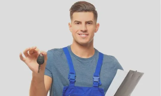 man holds a car key