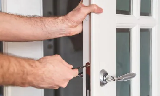 man repair door lock