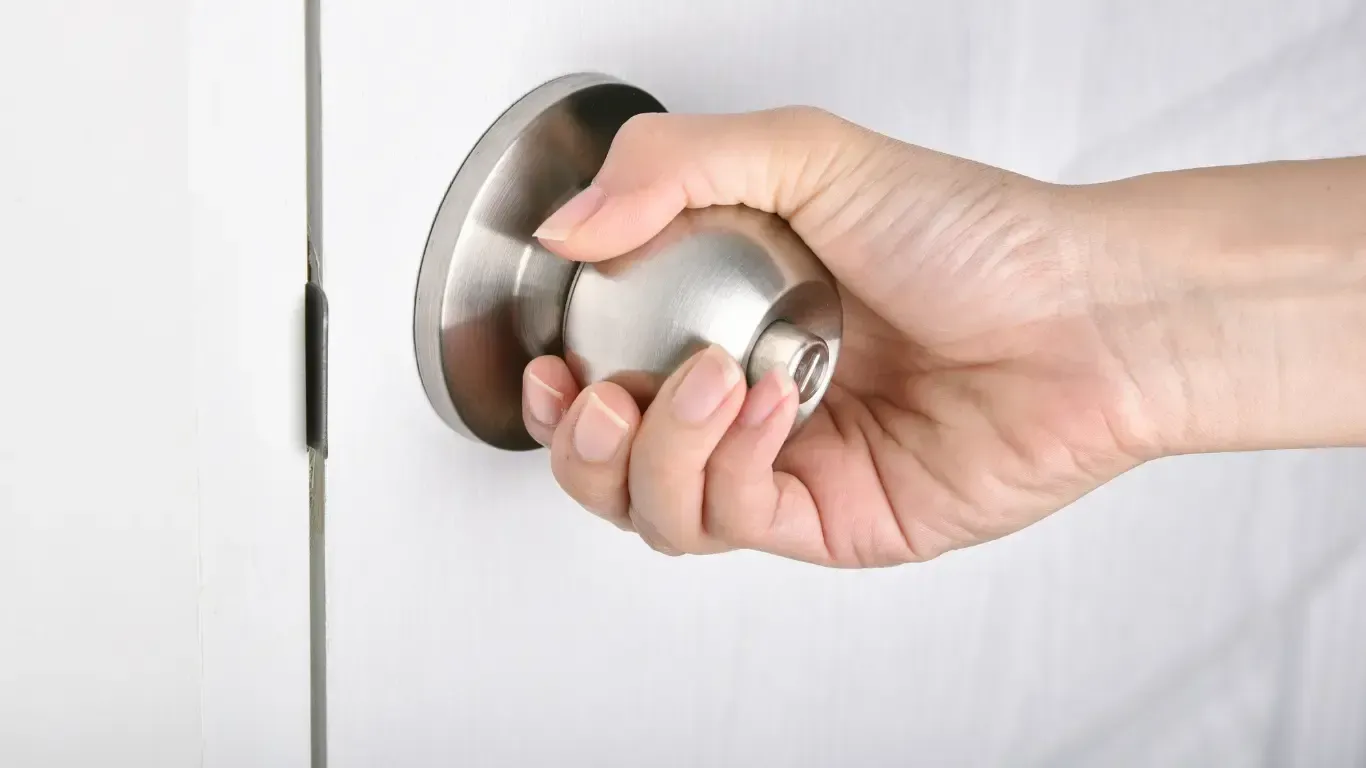 Hand on Locked Door