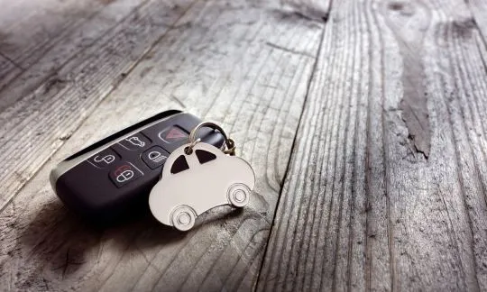 car key fob on the wooden desk