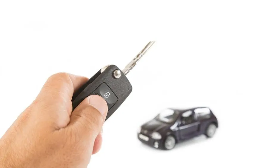 hand holding car key