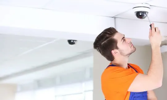 locksmith sets up a camera