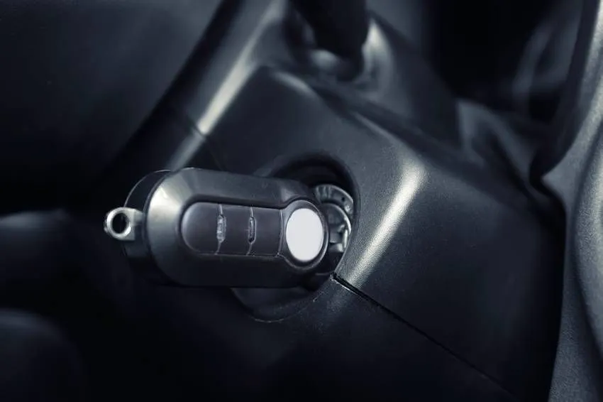 Closeup view of car key in ignition lock