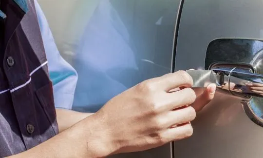 man try to unlock a car