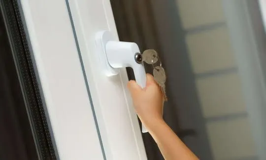 closed window with kid`s hand
