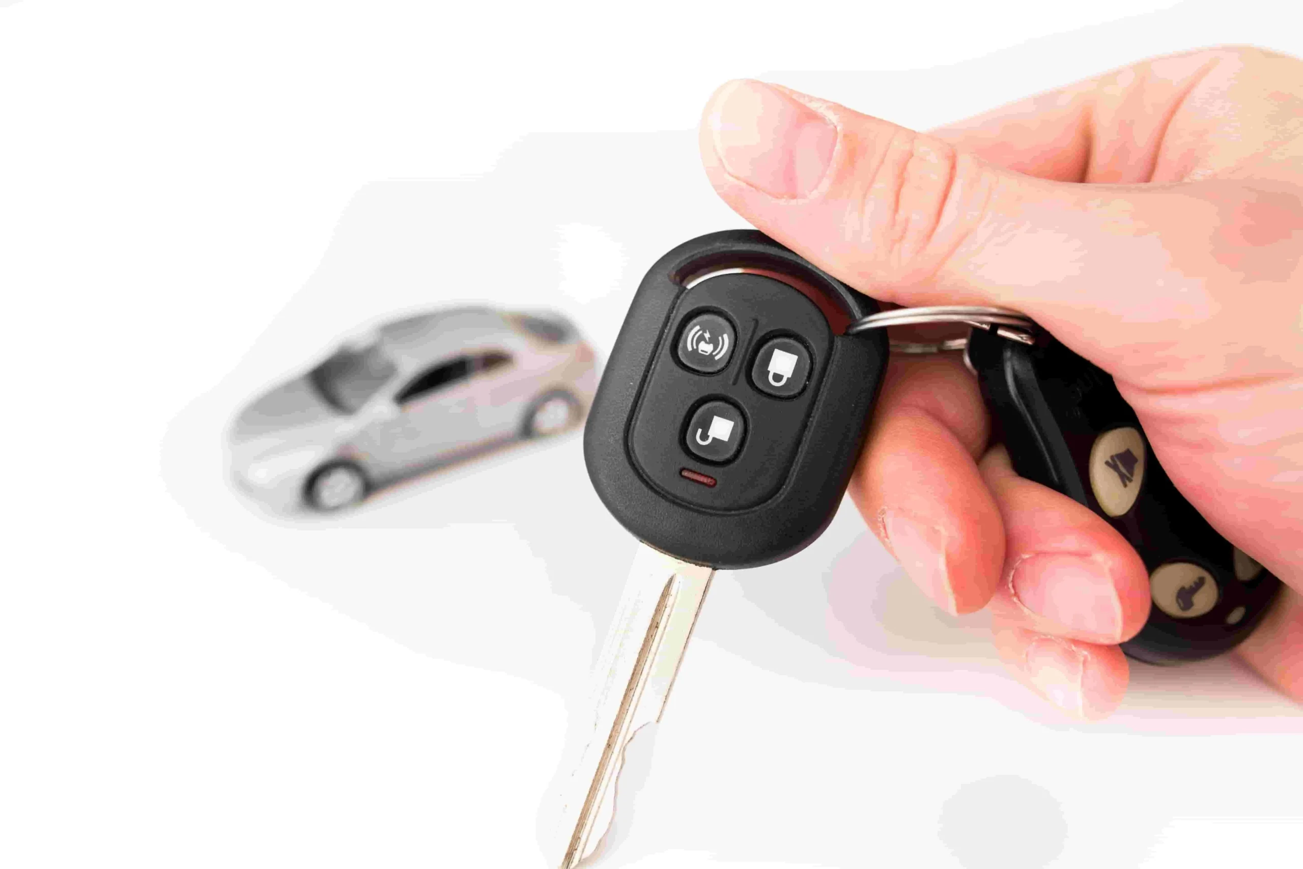car key with remote control in the hand